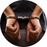 A man's hands restrained with handcuffs